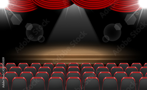 chairs and spotlight on the stage in the hall