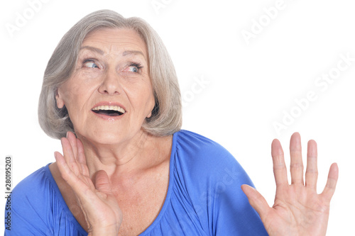 emotional happy senior woman posing on white background