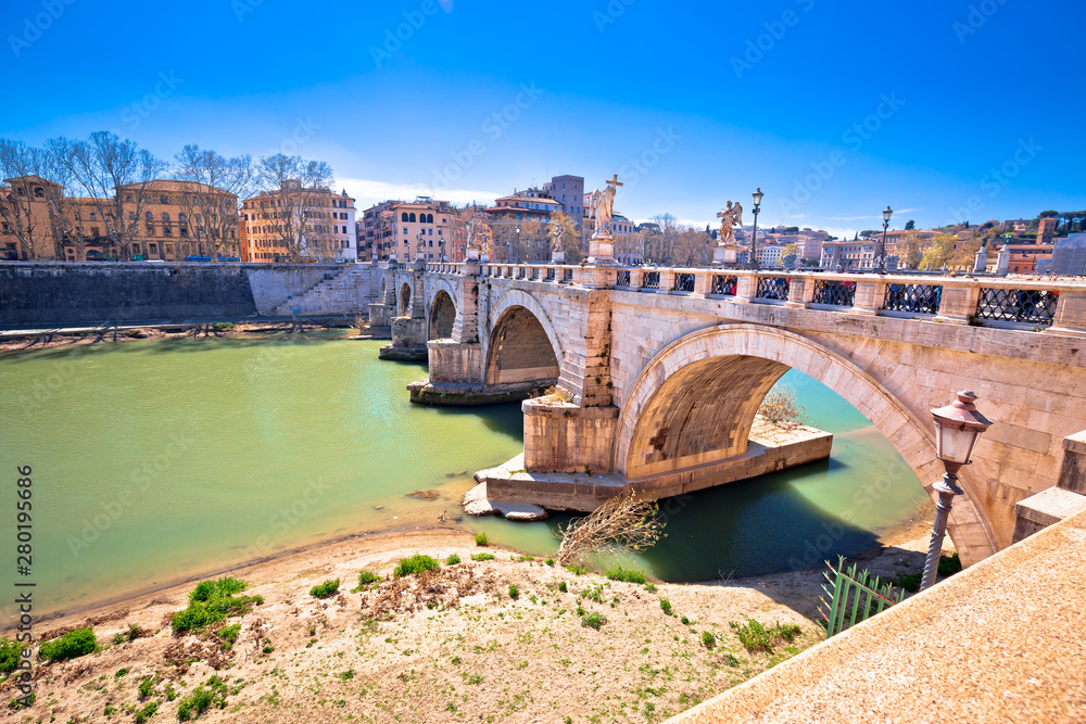 Ancient Ponte Sant Angelo stone bridge on Tiber river of Rome