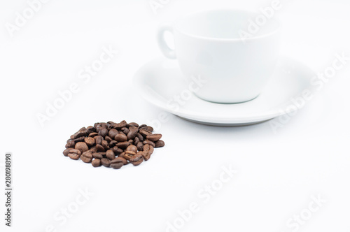 Coffee beans and cup isolated on white background.Copy space