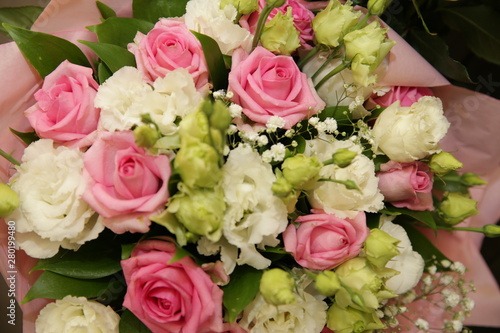 Beautiful bouquet of white and pink roses in blurry focus for background, inscription and postcard. Holidays, birthday, wedding, Valentino day.