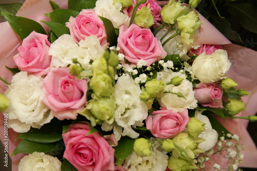 Beautiful bouquet of white and pink roses in blurry focus for background  inscription and postcard. Holidays  birthday  wedding  Valentino day.