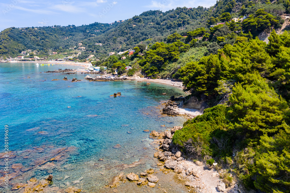 Aerial view of beautiful green and rocky island in the blue ocean. Aerial view of beautiful green and rocky island in the blue ocean.