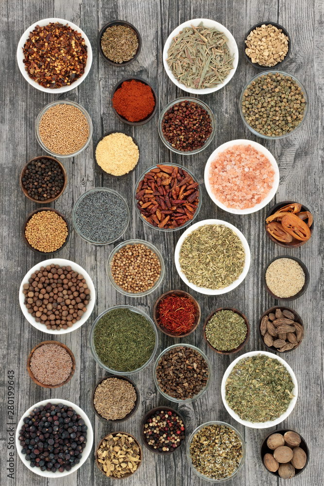 Dried herbs and spices on rustic wood background. Dried herbs and spices on rustic wood background.