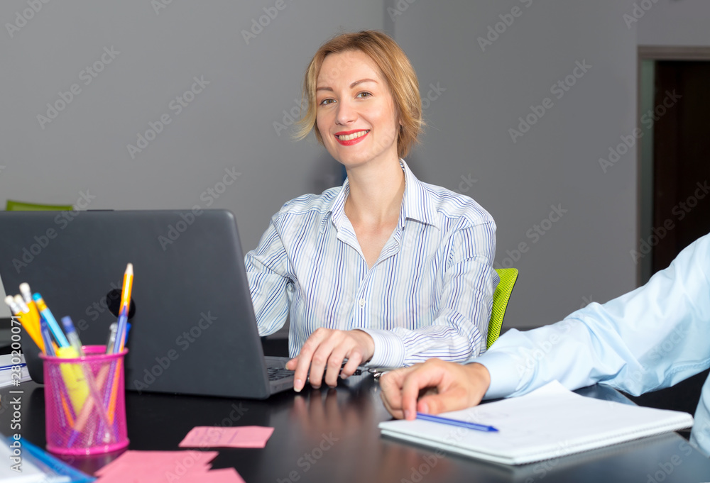 Business woman working in the office. Manager is using a laptop. Business woman working in the office. Manager is using a laptop.