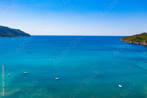 Calm blue ocean and clear sky background