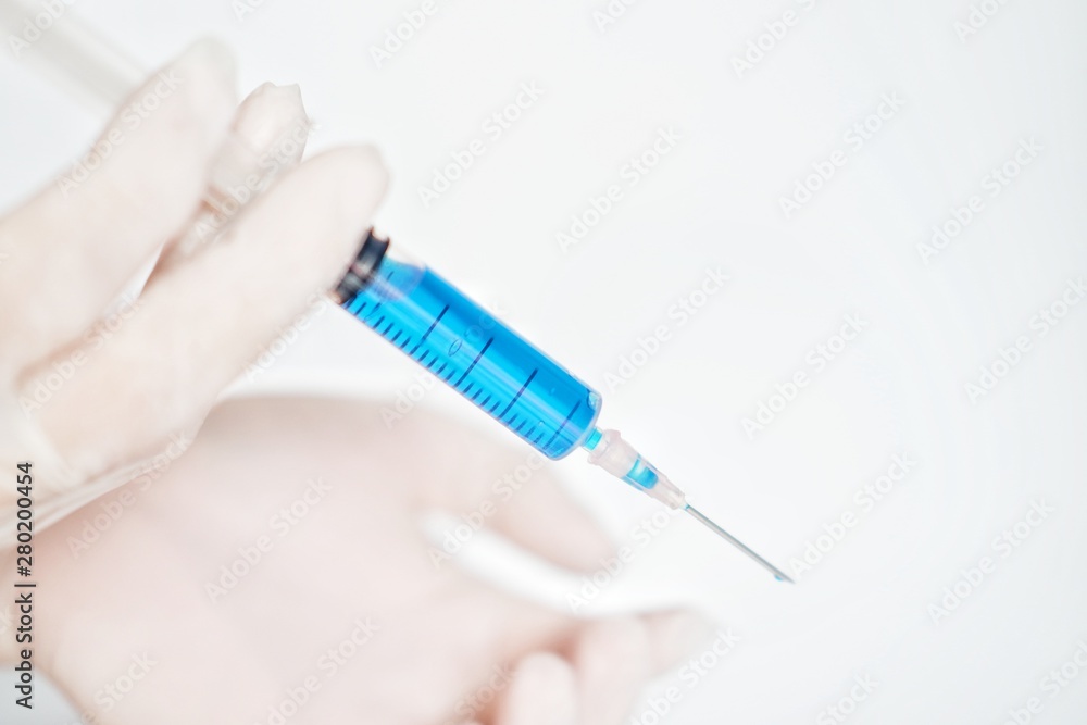 syringe in hand isolated on white background syringe in hand isolated on white background