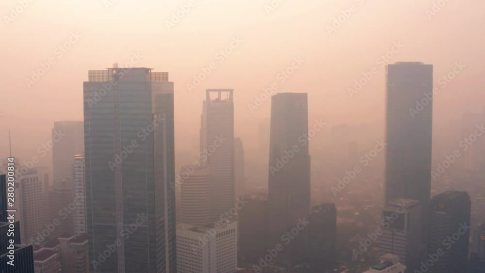 Jakarta city under air pollution at sunrise Jakarta city under air pollution at sunrise
