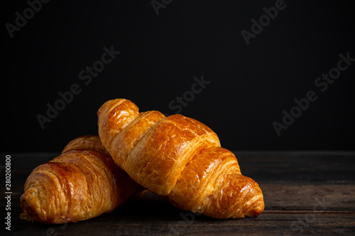 croissants on old wooden table.