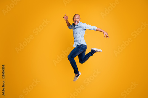 Full body photo of funky man feel content careless isolated over yellow background © deagreez
