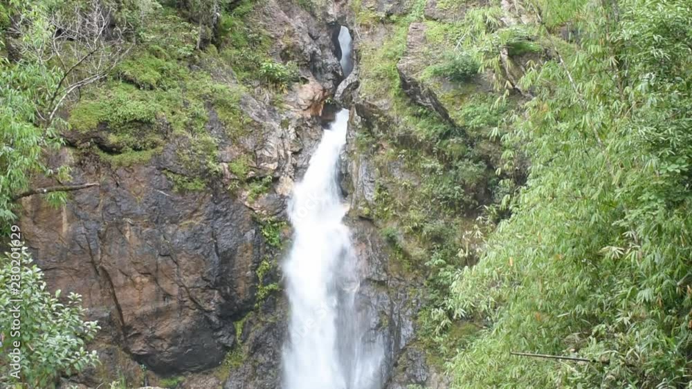 Waterfall flowing from the mountains at Jokkradin waterfall in Thong Pha Phum National Park , Kanchanaburi inThailand. Waterfall flowing from the mountains at Jokkradin waterfall in Thong Pha Phum National Park , Kanchanaburi inThailand.