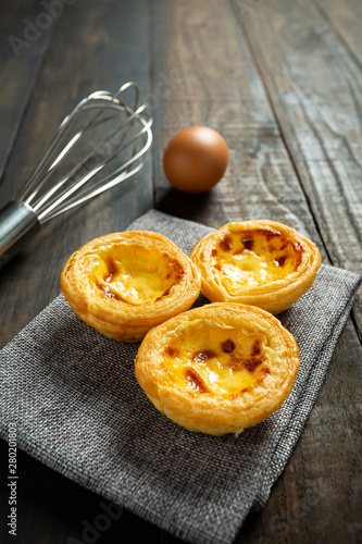 Photography Egg tart on wooden background.
