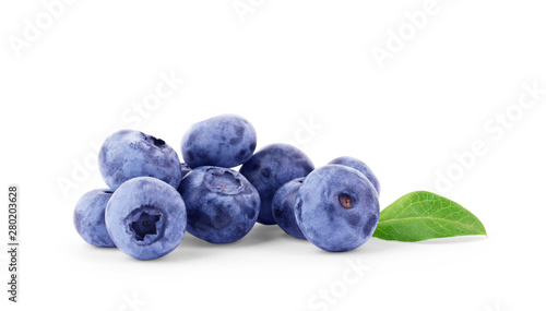 Fresh blueberries with leaves isolated on white background