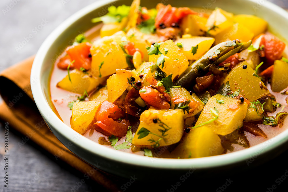 Lauki/doodhi ki Sabji also known as bottle gourd curry. served in a bowl or karahi. selective focus Lauki/doodhi ki Sabji also known as bottle gourd curry. served in a bowl or karahi. selective focus