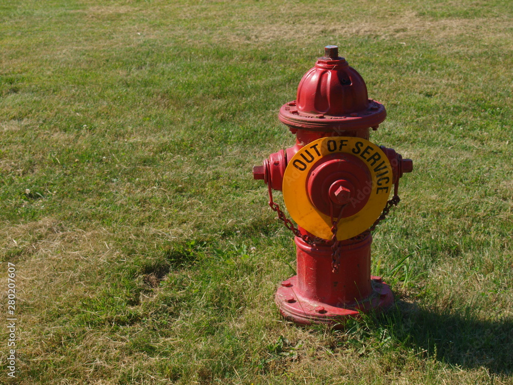 Red fire hydrant with Out Of Service sign no water Red fire hydrant with Out Of Service sign no water