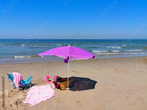 beach umbrella parasol on the beach on a sunny day