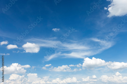 Autumn blue sky background texture with white spindrift very clouds.
