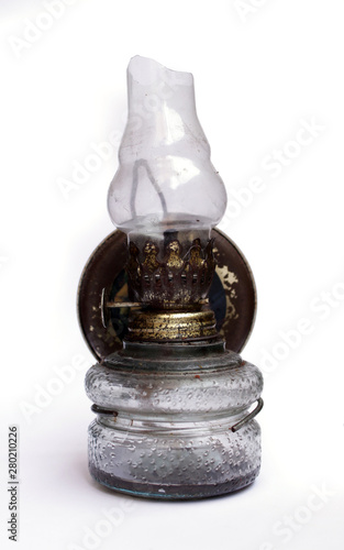 broken old oil lamp on isolated background