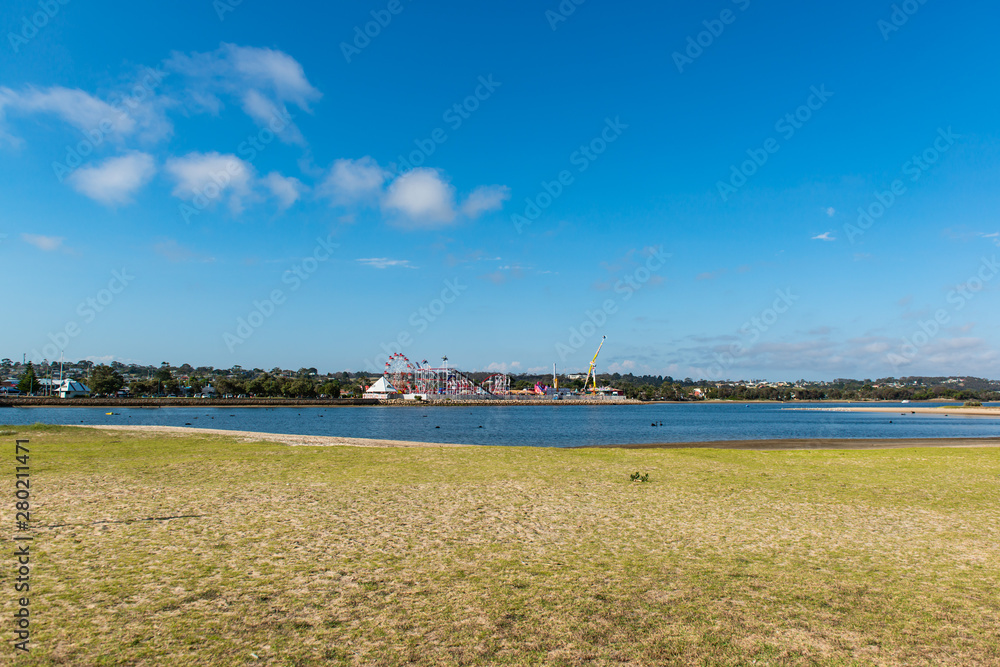 view of beach with blue sky and clouds