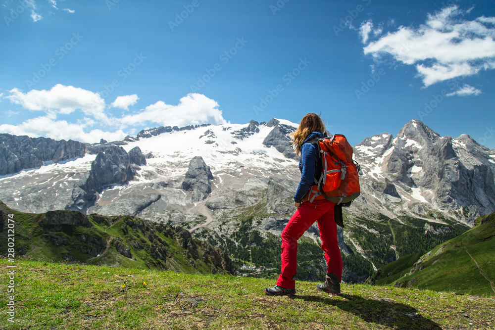 Hiking woman in the Alps, Dolomites, Italy. Hiking woman in the Alps, Dolomites, Italy.