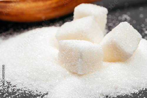 Group of refined white sugar cubes close up