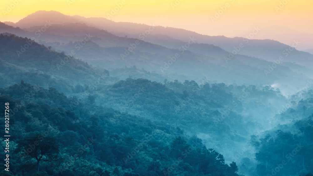 earth day and environment care travel concept from beautiful landscape of tropical forest with haze with soft focus of layer mountain background