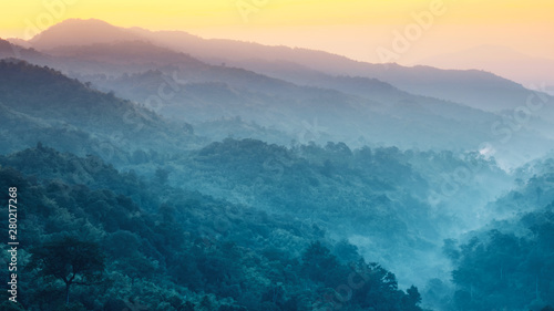 earth day and environment care travel concept from beautiful landscape of tropical forest with haze with soft focus of layer mountain background © tickcharoen04