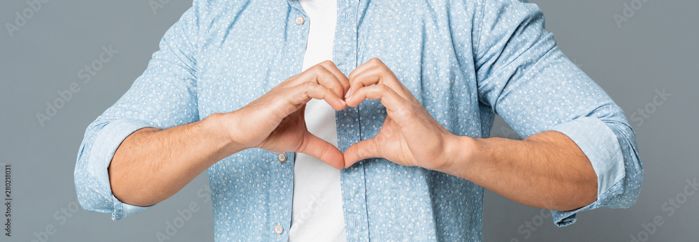 Heart-Shaped Male Hands Gesture Closeup On Gray Background - obrazy, fototapety, plakaty 
