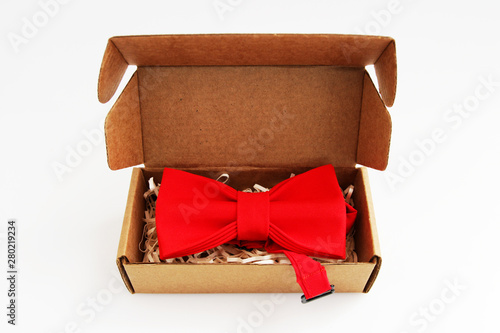 bow tie in a cardboard gift box. Color red photo