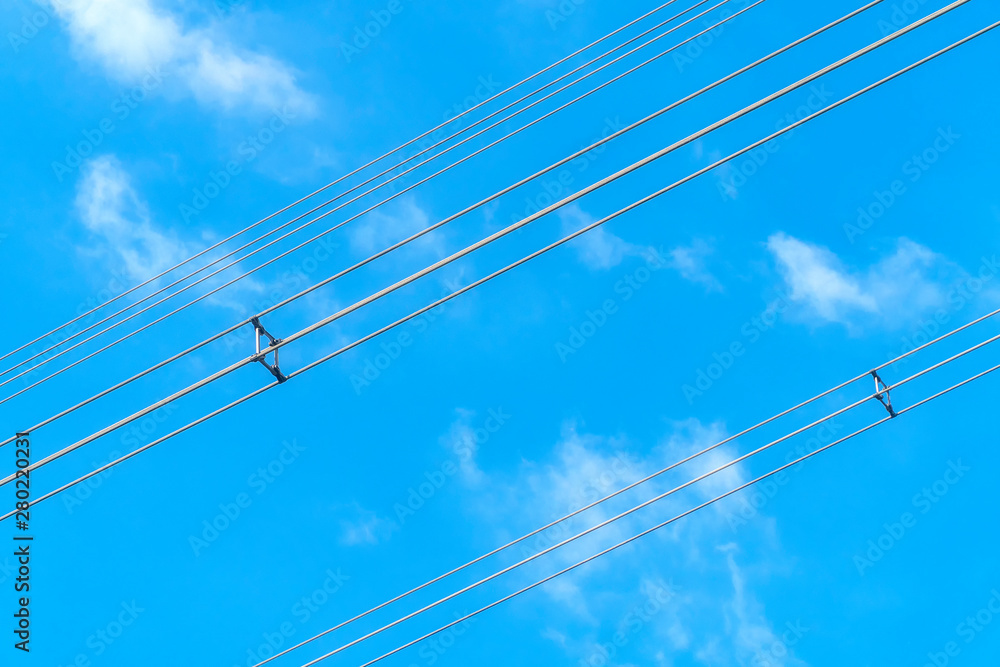 Fotografie Wires power high and blue sky background.