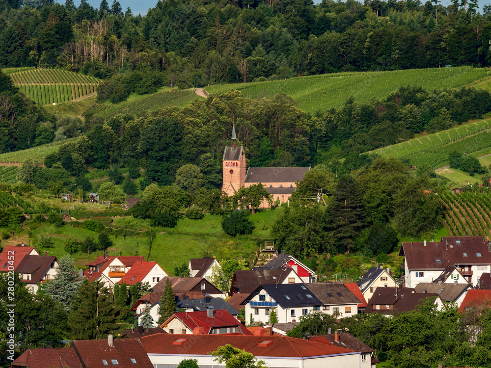 Little cozy german village between the green hills, vineyards in Black Forest