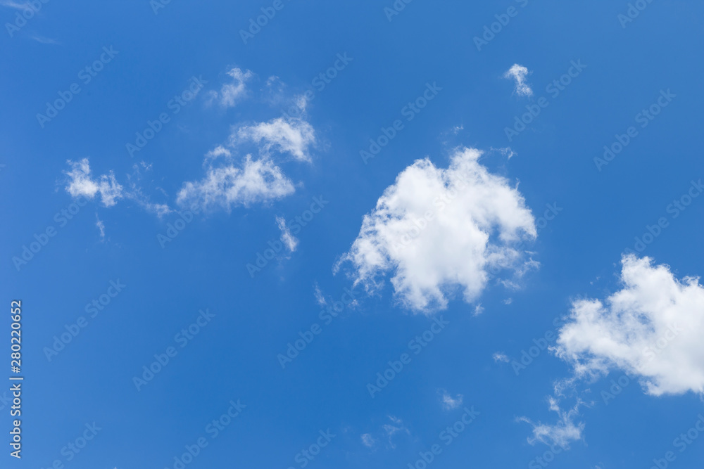 Soft white cloud floating over clear blue sky, summer and spring sky, weather and season background Soft white cloud floating over clear blue sky, summer and spring sky, weather and season background