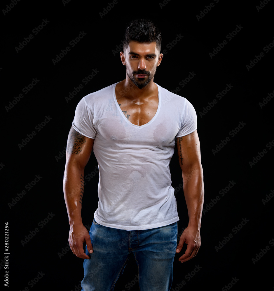 Handsome Male Fitness Model Wearing Jeans and White T-Shirts Stock ...