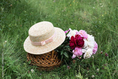 Basket with peony flowers