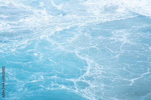 Sea Waves in ocean wave Splashing Ripple Water. Blue water background. 