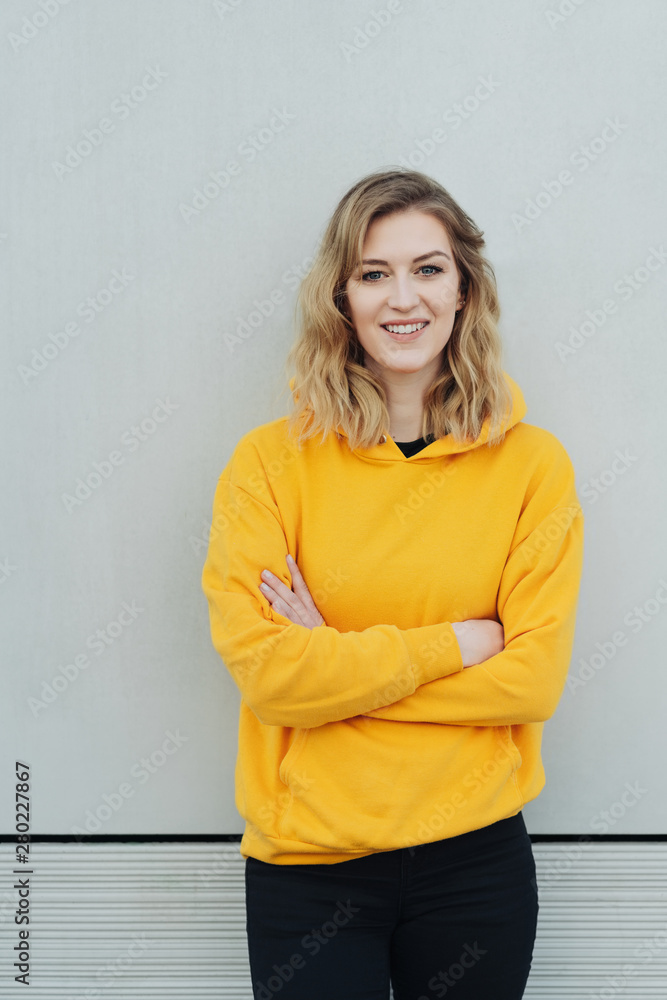 Relaxed young woman in a colorful yellow top Relaxed young woman in a colorful yellow top