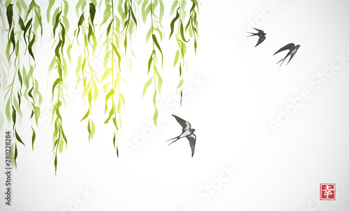 Flying swallow birds and green willow branches on white background. Traditional Japanese ink wash painting sumi-e. Hieroglyph - happiness.