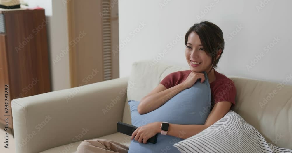 Woman watch on tv at home