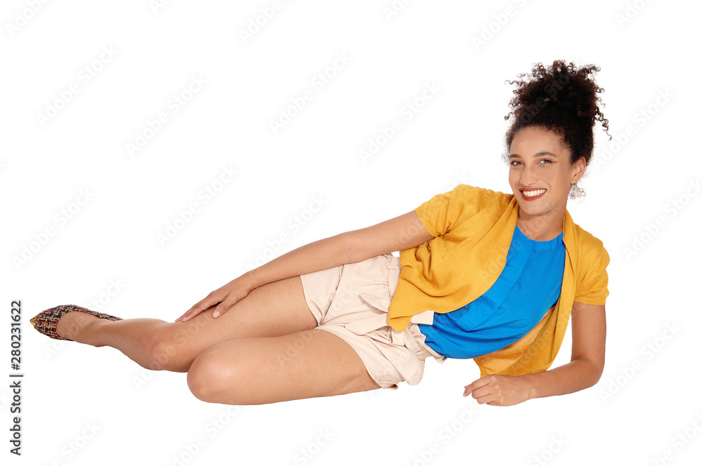 Lovely young multi-racial woman lying on the floor Lovely young multi-racial woman lying on the floor