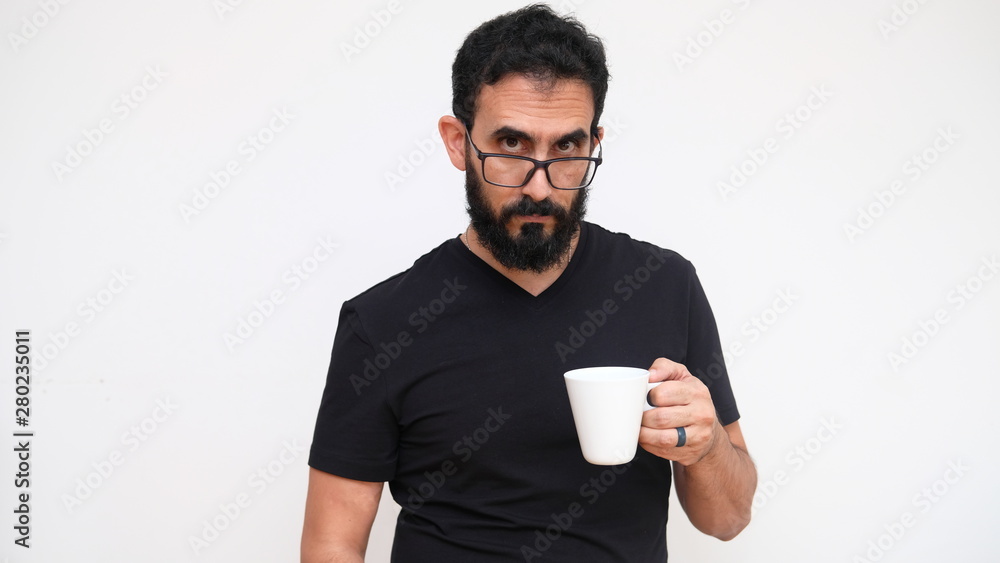 Middle age man in a white backround holding a cup of coffee Middle age man in a white backround holding a cup of coffee