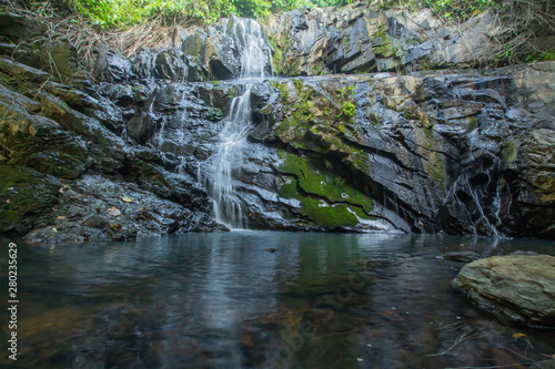 Ton Aow Yon Waterfall rich natural resources in the forest asia tropical areaat Island Phuket Thailand.