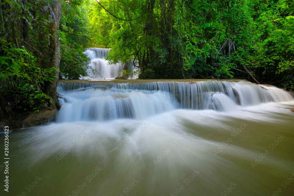 Beautiful waterfall in green forest shoot by slow shutter speed to make the water look softer, Huay Mae Kamin Waterfall in Thailand