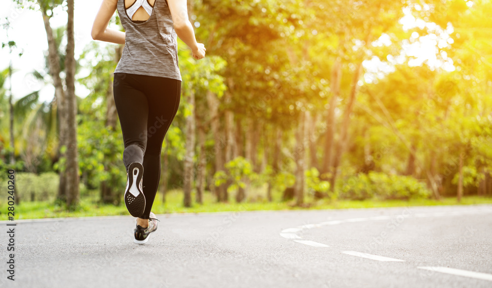 Φωτογραφία Young fitness sport woman running on the road in the morning, Young fitness sportswoman runner running on tropical park trail
