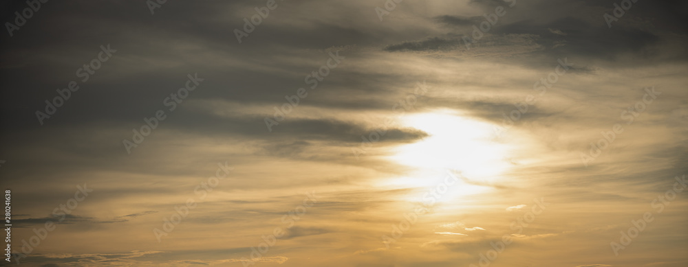 golden skies in a summer sunset panorama