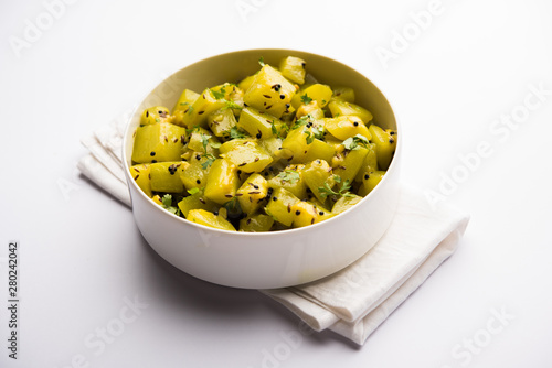 Lauki/doodhi ki sookhi Sabji also known as bottle gourd dry vegetable recipe. served in a bowl or karahi. selective focus photo