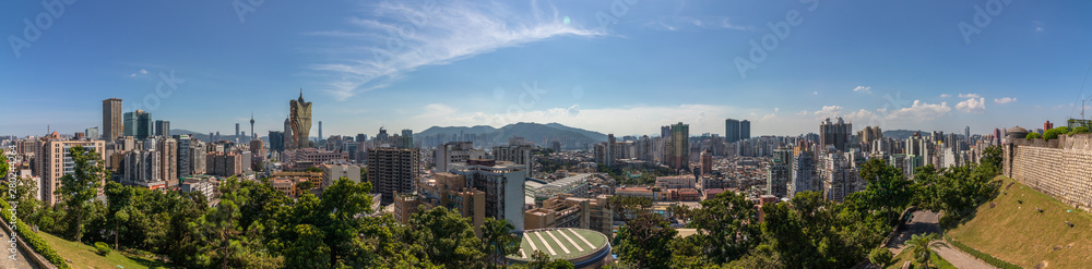 Large Panoramic view on Skyline of central District of Macau inside Nature. Vegetation in foreground. Santo António, Macao, China. Asia.