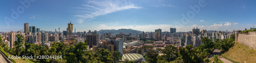 Large Panoramic view on Skyline of central District of Macau inside Nature. Vegetation in foreground. Santo António, Macao, China. Asia. © unununius
