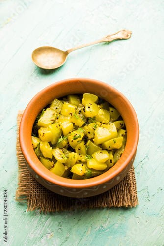 Lauki/doodhi ki sookhi Sabji also known as bottle gourd dry vegetable recipe. served in a bowl or karahi. selective focus photo