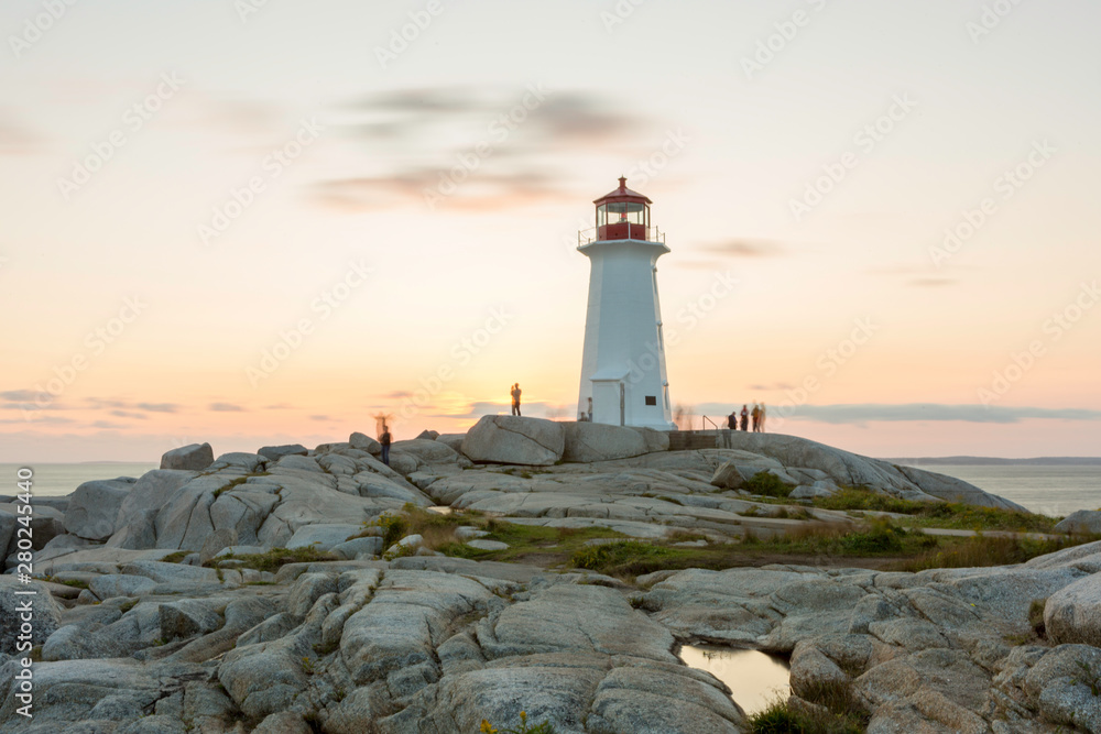 Nova Scotia,Canada,11,2017:Peggy,s cove lighthouse at sunset and at night
