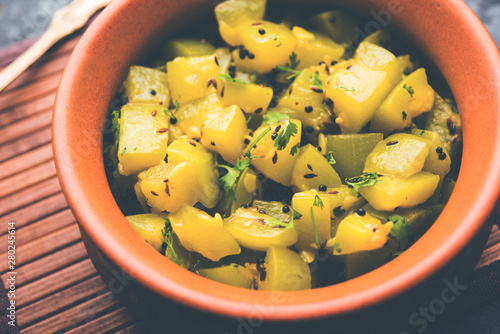 Lauki/doodhi ki sookhi Sabji also known as bottle gourd dry vegetable recipe. served in a bowl or karahi. selective focus photo